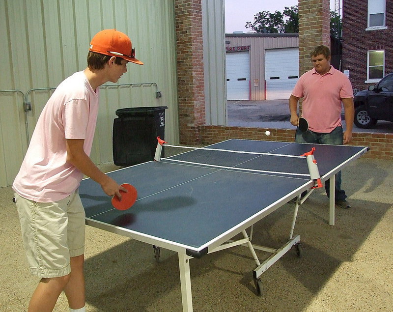 Image: Ty Windham serves to Colin Newman in the Ultimate Gladiator Challenge under the downtown pavilion roof.