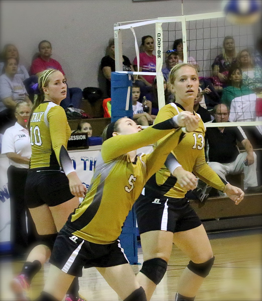 Image: Lady Gladiator junior Tara Wallis(5) keeps the volley going while teammates Madison Washington(10) and Jaclynn Lewis(13) maneuver back into position.