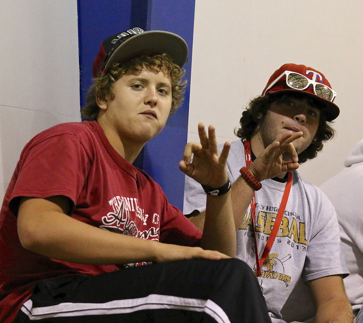 Image: Members of the Gladiator football team, Bailey Walton and Kyle Fortenberry, are on hand to cheer on their ladies.