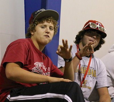 Image: Members of the Gladiator football team, Bailey Walton and Kyle Fortenberry, are on hand to cheer on their ladies.