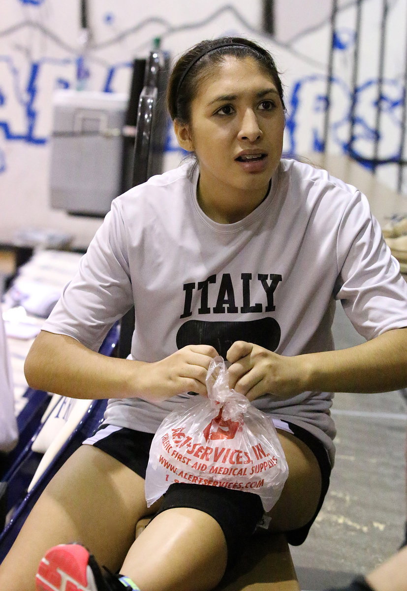 Image: JV Lady Gladiator Elizabeth Garcia ices her knee after her team’s match against Frost.