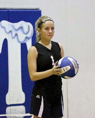 Image: JV Lady Gladiator Britney Chambers(1) waits for the whistle so she can serve.