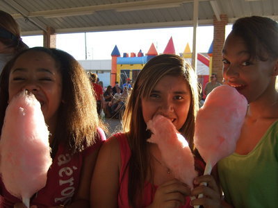 Image: Danaisia McCowan, Jennifer Salas and Skyler are enjoying their cotton candy.