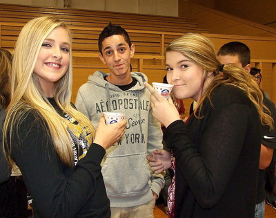 Image: Annie Perry and Grace Haight enjoy their snow cones while Jack Hernandez wishes he had snow cone.