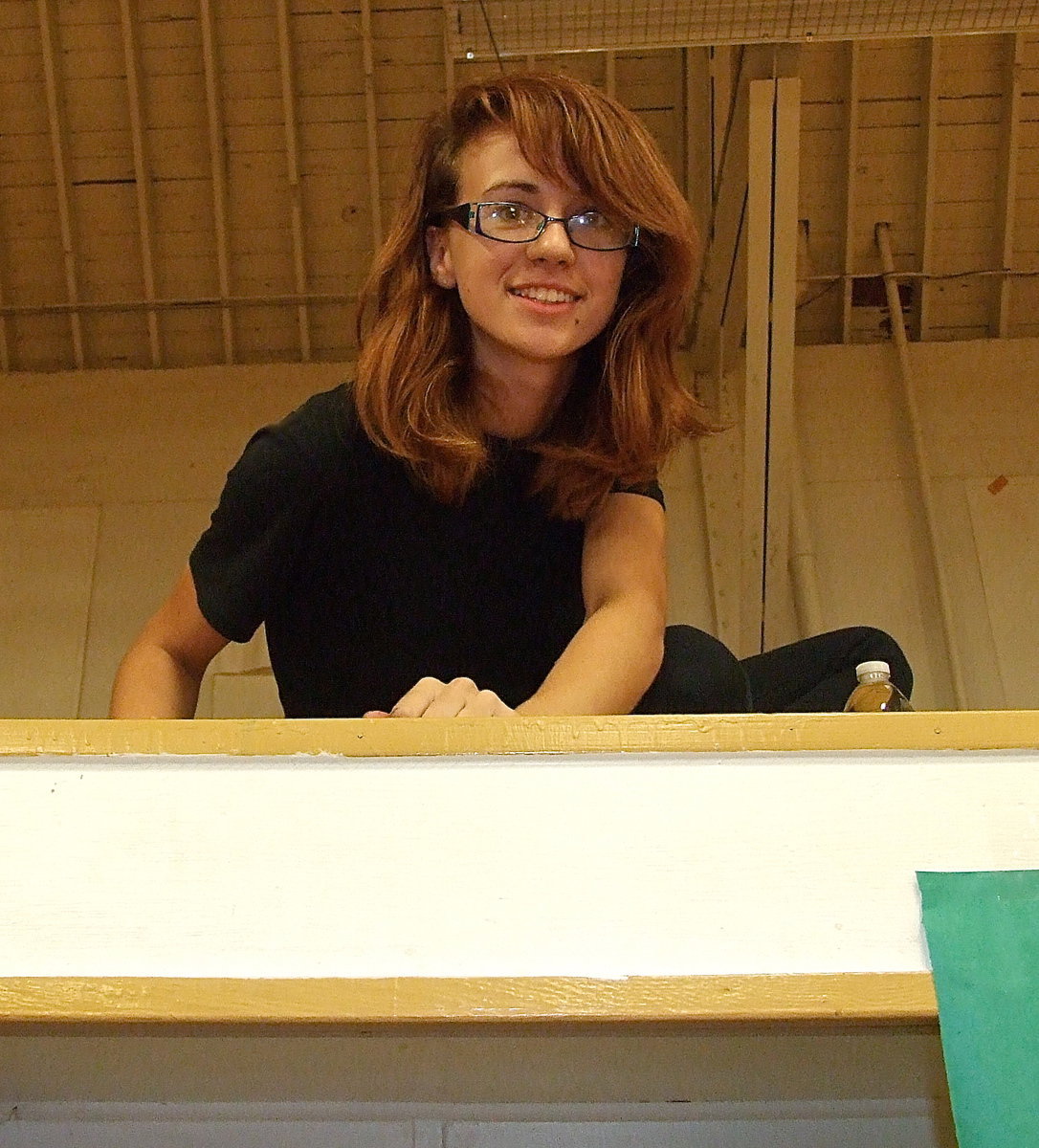 Image: Caitlin Sheppard takes a peek down at the yearbook ordering table.