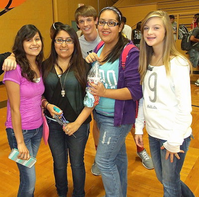 Image: Jessica Garcia, Suzy Rodriguez (Class of 2013 alumni), Ty Windham, Lorena Rodriguez and Kristen Viator share in the fun of the yearbook signing party held in the old Italy gym.