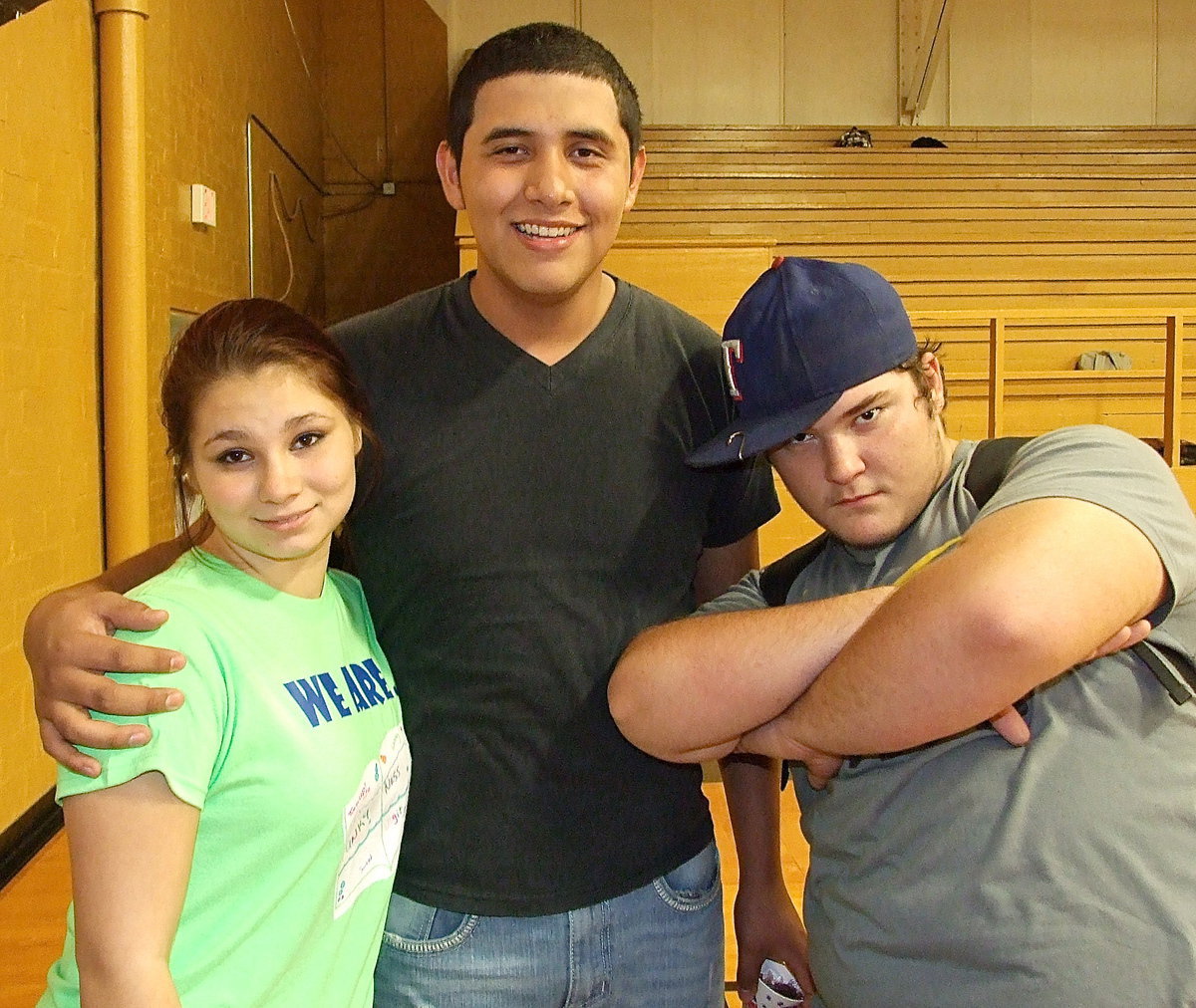 Image: Desi Brooks, Miguel Estrada and Nathan Kerbow are enjoying the yearbook signing party.