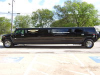 Image: Big, black limo parked in front of Stafford Elementary