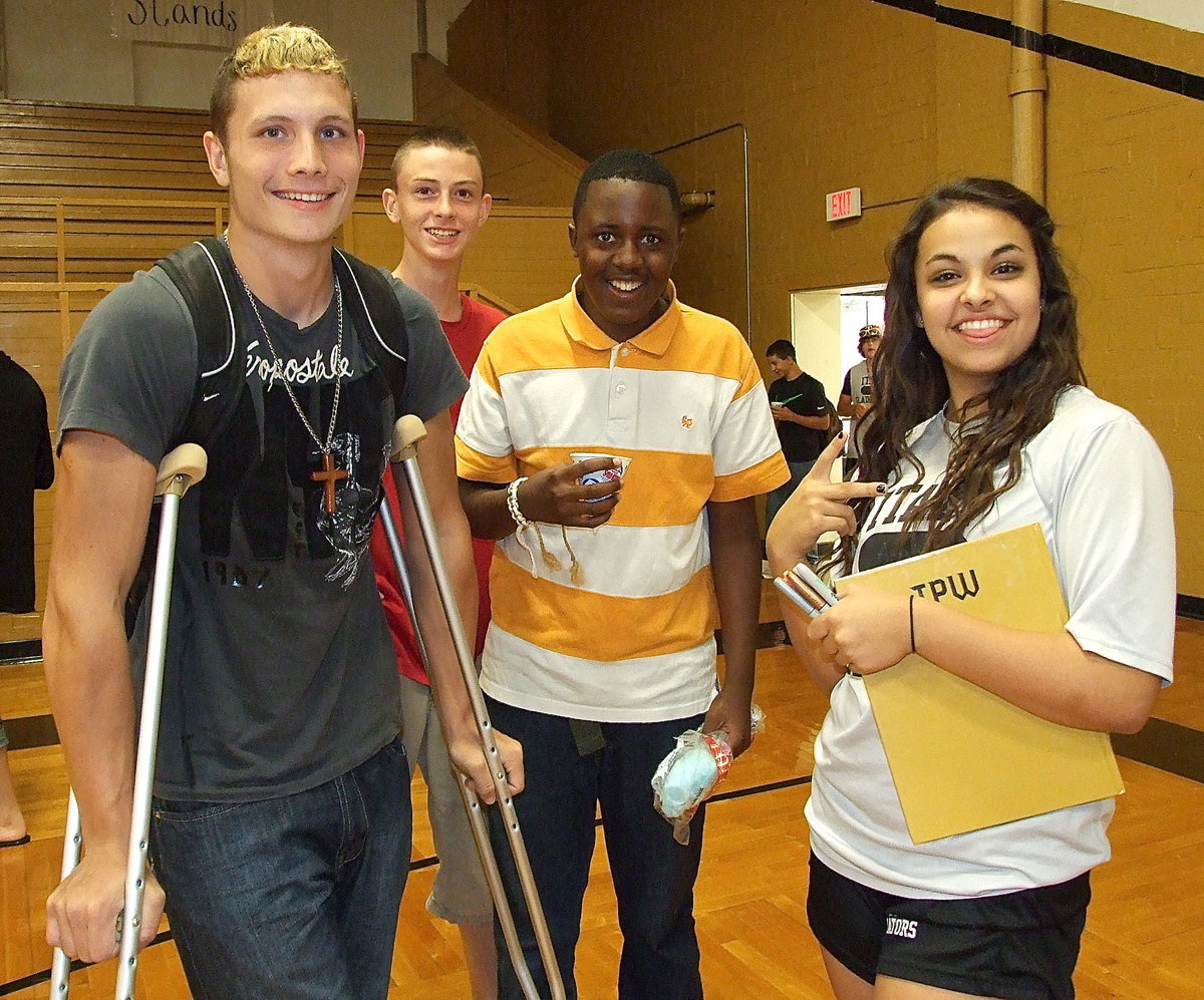 Image: Coby Bland, Damon Murdock, Anthony Lusk and Ashlyn Jacinto wrap up the yearbook signing party with four happy smiles.