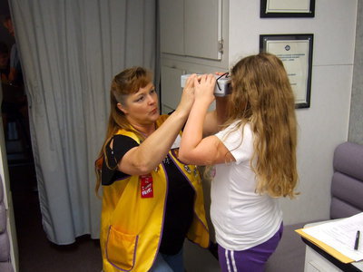 Image: Flossie Gowin is helping with eye tests.