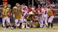 Image: Zain Byers(50) comes out of the pile with his second fumble recovery of the game for the Gladiator defense.