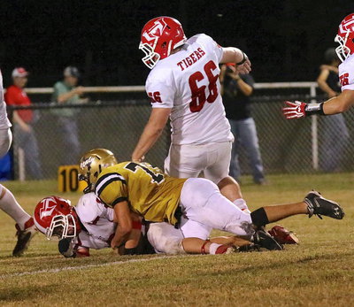 Image: Cody Medrano(75) makes another tackle for the Gladiator defense.
