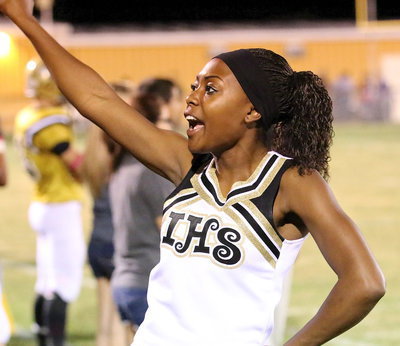 Image: Italy High School cheerleader K’Breona Davis helps lead the cheers for the Gladiators.