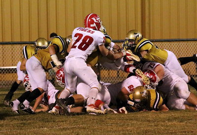 Image: Hico dives in for a touchdown despite the best efforts from Gladiators’ John Byers(56), Bailey Walton(54), Kevin Roldan(60), Shad Newman(25) and Justin Wood(4).