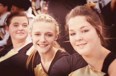 Image: Color guard members Kylee Dabney, Kayla Cunningham and Sarah Burrow are preciously proud to be Gladiators!