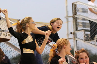 Image: Anna Riddle, Tatum Adams, Kayla Cunningham and Sarah Burrow celebrate the singing of the school song.