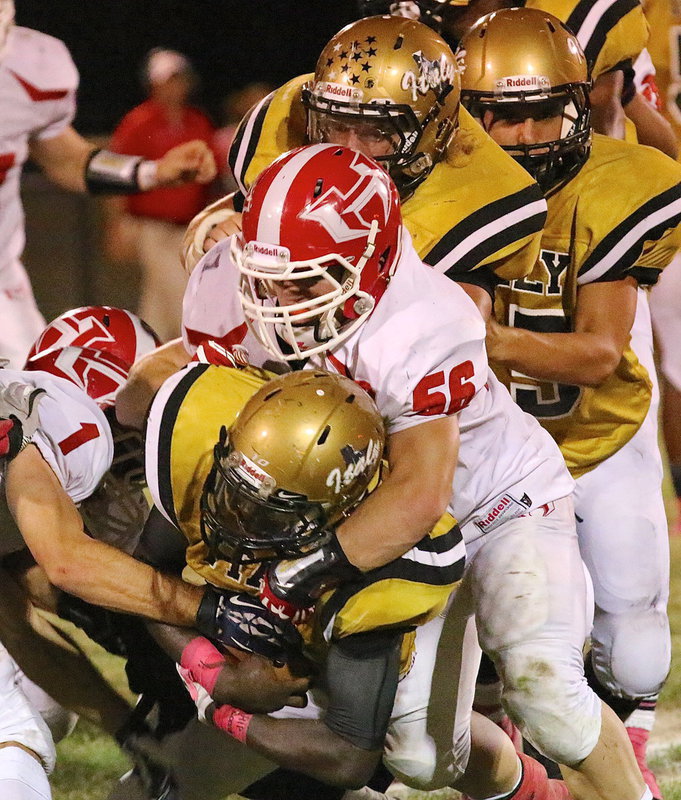 Image: TaMarcus Sheppard(10) fights for an extra inch against Hico’s defense with help from fullback Shadrach Newman(25) and guard Cody Medrano(75).