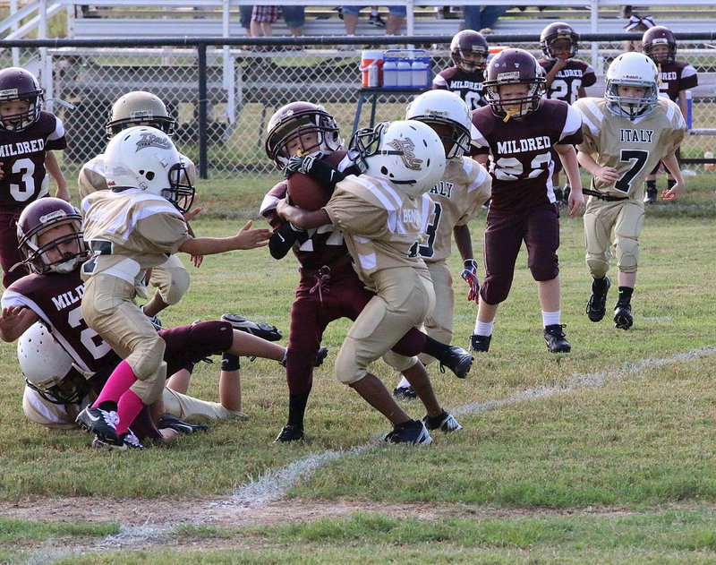 Image: C-team safety Curtis Benson(1) fills the lane to stop a Mildred player from advancing further.