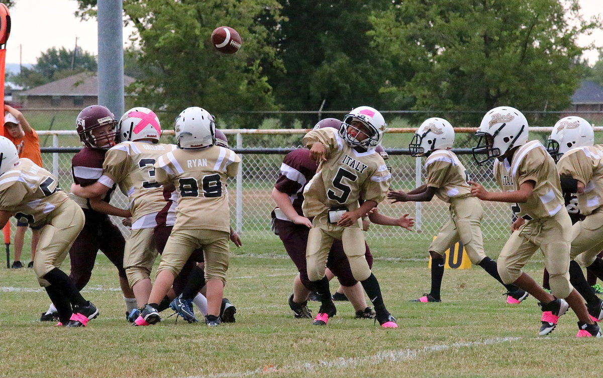 Image: B-team quarterback Jeremy Munoz(5) lets it fly against the Eagles.