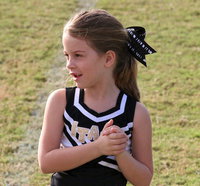 Image: IYAA C-team cheerleader Mia Droll helps perform a cheer for fans.