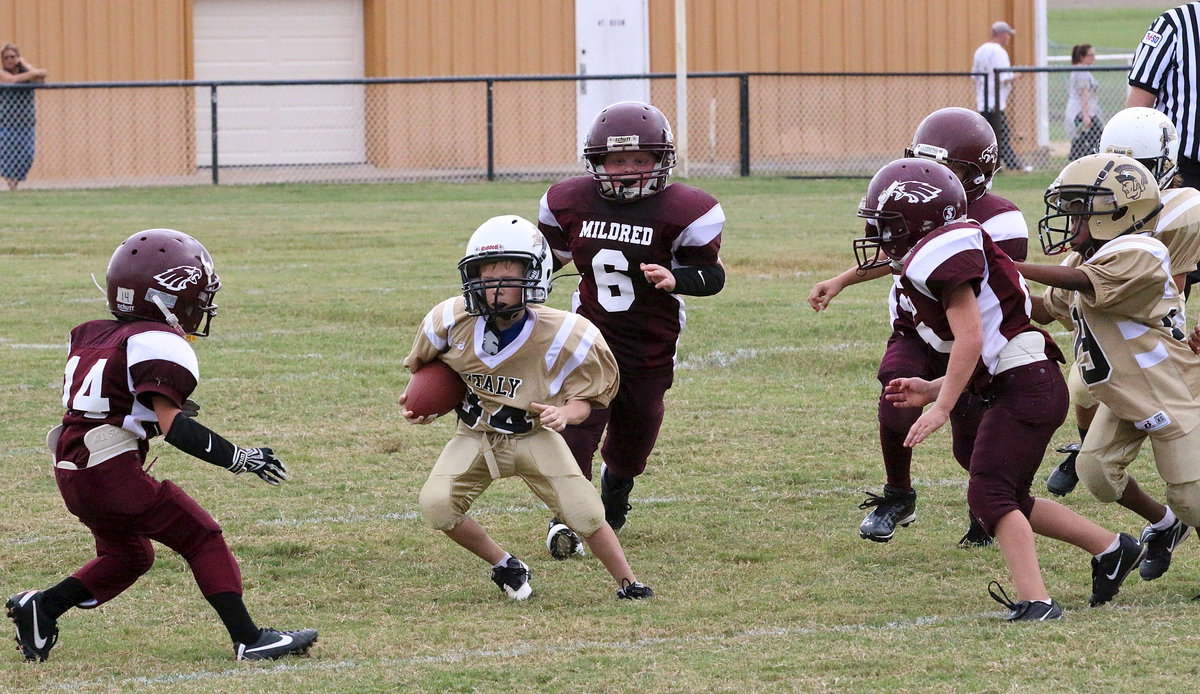 Image: Dustin Duke(34) makes a move to reach the sideline.