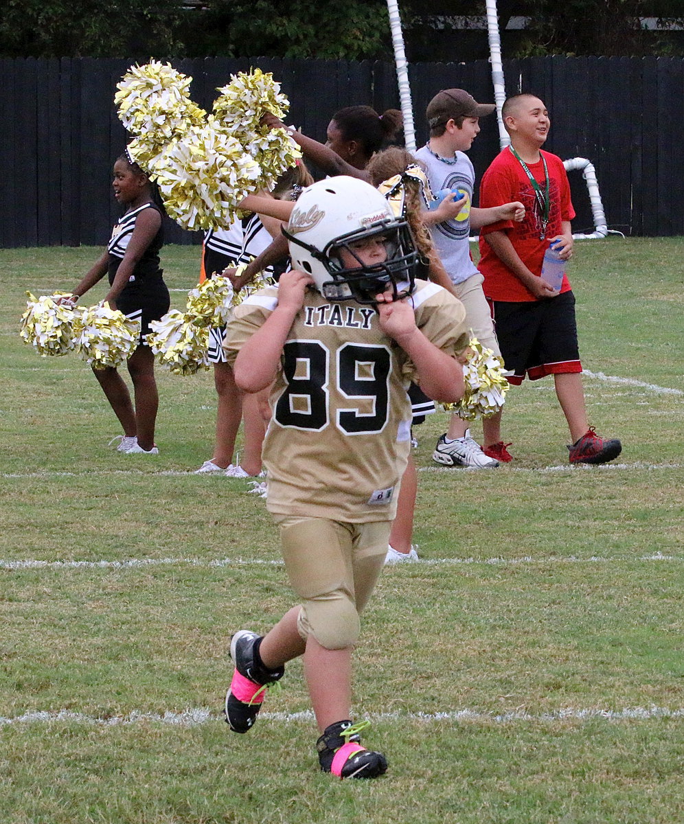 Image: Wyatt Ryan(89) buckles up as he takes the field against Mildred.