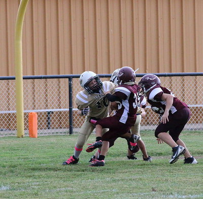 Image: Ty Cash(10) takes out two Eagle defenders to squirt Jalyn Wallace(2) into the end zone for 2-points.