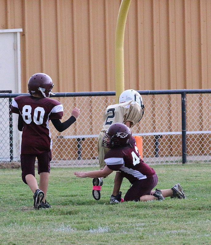 Image: Jalyn Wallace(2) drives thru an Eagle tackler for a score.