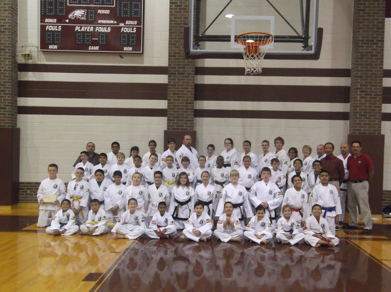 Image: Pictured below top row:  Master Charles Kight-Chief Instructor, Mario Perez-Black Belt-Milford, Amy Tinney-Black Belt-Hillsboro, Jacob Garcia-Hillsboro, D’Ann Drennan-Black Belt-Grandview, John Drennan-Black Belt-Grandview, Kathryn Ekness-Hillsboro, Dana Bennett-Black Belt-Hillsboro, Jacob Jean-2nd Degree Black Belt-Blum, Kevin Devers-3rd Degree-West, Travis Tinney-Black Belt-Hillsboro,  Isamar Perez-Black Belt-Milford, Ross Gilcrease-Black Belt-Hillsboro, David Jones-Black Belt and Instructor-Malone, and Danny Smith-Black Belt and Sparring Instructor.
    Second Row:  Hunter Smith-Black Belt-Whitney, Esteban Ramirez-Hillsboro, William West-Black Belt-Whitney, Alex Lopez-Hillsboro, Jacob Young-Hubbard, Keaton Pustejovsky-Abbott, Clayton Tribble-West, Jacob Divin-West, Jayson Orr-Hillsboro, Maddie Strickling-Whitney, Tanner Marak-West, Rogelio Montes-Hillsboro, Ruben Montes-Hillsboro, Grand Master Park-Las Vegas, Nevada and Master Jeff Wiles-Round Rock.
    Third Row:  Caleb Girard-Hillsboro, Michael Russell-Italy, Joaquin Trejo-Black Belt-Hillsboro, Patrick Runyon-Itasca, Brayden Hodges-Hillsboro, Michael Gonzalez-Italy, Katheryn Drennan-Black Belt-Grandview, Elizabeth Moore-Black Belt-Abbott, J.D. Bennett-Black Belt-Hillsboro, Thomas Drennan-Black Belt-Grandview, Michael Smith-Grandview, and Luis Rodriguez-Hillsboro.
    Bottom Row:  Miguel DeLuna-Hillsboro, Miguel Fuentes Jr.-Hillsboro, Xanden Stewart-Hillsboro,  Alejandro Sanchez-Hillsboro, Ryan Riojas-Hillsboro, Roy Gallardo Jr.-Hillsboro, Adam Riojas-Hillsboro, Bailey Armstrong-Waco and Nick Sam-Italy.