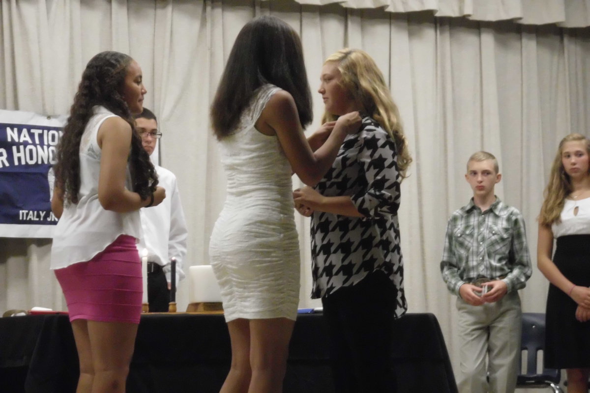 Image: Brycelen Richards receives her pin.