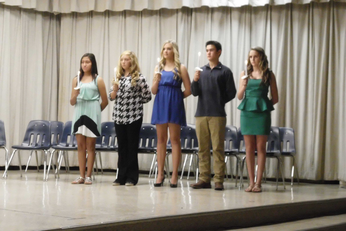 Image: The outgoing NJHS officers passed their candles to the new officers. (left to right) Marlen Hernandez, Brycelen Richards, Annie Perry, Kyle Dodd and Kirby Nelson.