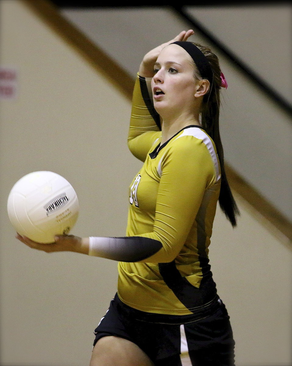 Image: Madison Washington(10) serves with authority.