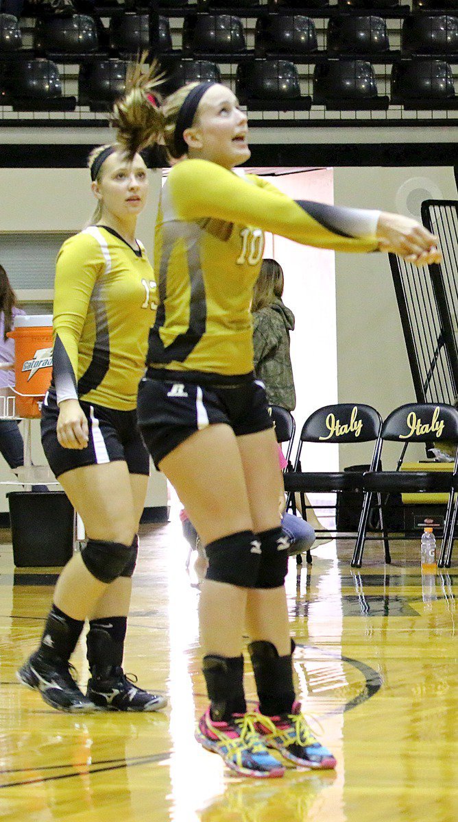 Image: Jaclynn Lewis(15) watches as teammate Madison Washington(10) reacts to a Bynum serve.