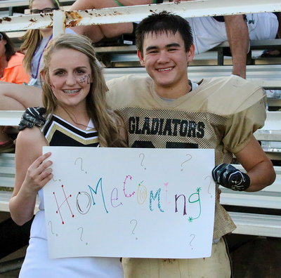 Image: Aaaawwww! After the Junior High game, Gladiator Kyle Tindol(25) surprised cheerleader Kirby Nelson with this one question…