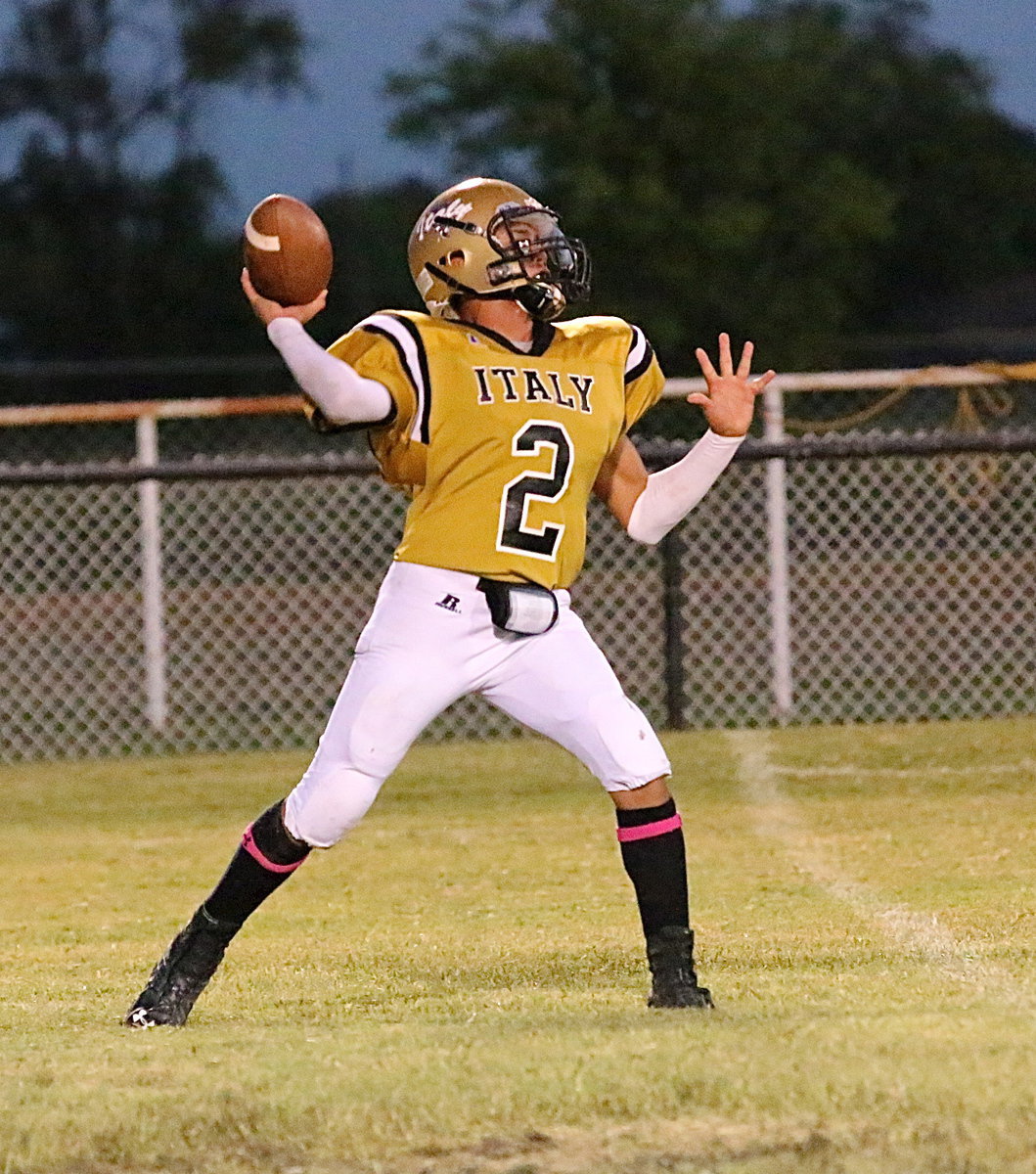 Image: JV quarterback Joe Celis(2) drops back to throw the ball downfield.