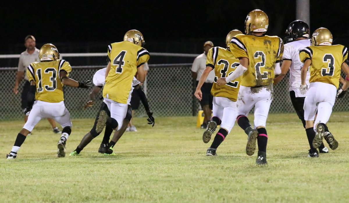 Image: Justin Wood(4) follows a convoy of Italy blockers as he weaves his way down the field.