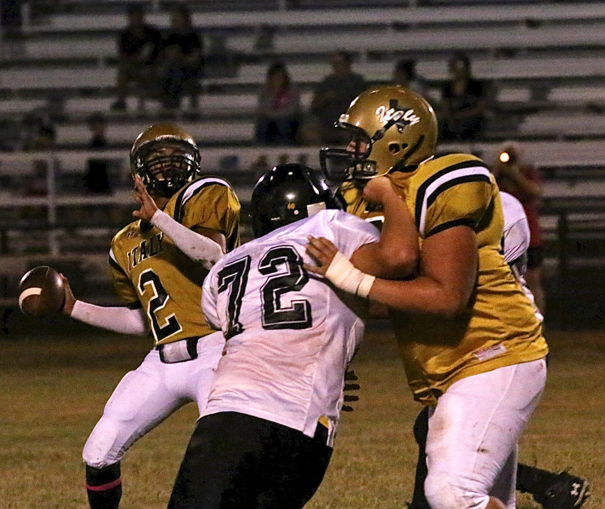 Image: Austin Pittmon(65) buys his quarterback Joe Celis(2) time in the passing pocket.