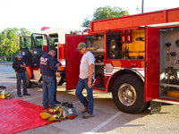 Image: Italy’s volunteer firemen getting ready to show the Stafford students the fire truck.