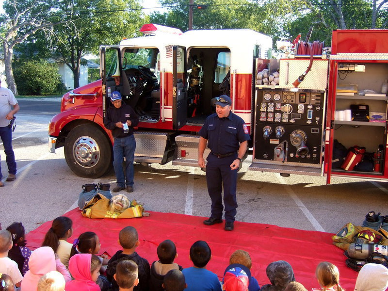 Image: Fireman Jackie Cate tells the students about some of the fire safety tips they will learn today.