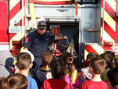 Image: Fireman Cate shows and explains about the Jaws of Life.