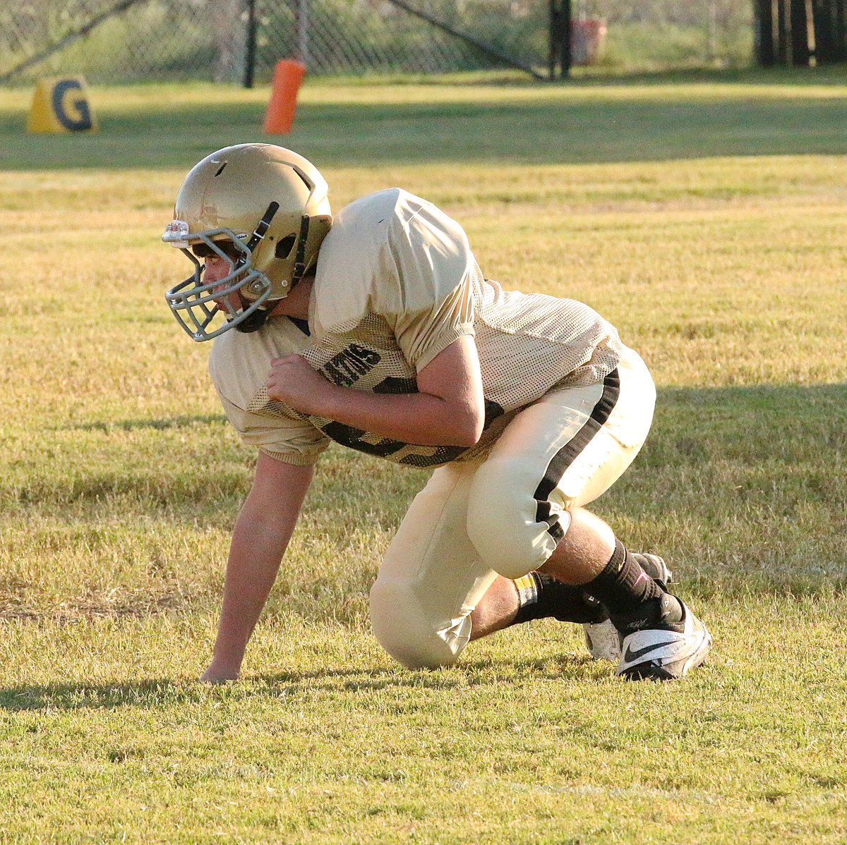 Image: Cade Roberts(58) and his junior high teammates punch out Itasca in the district opener.