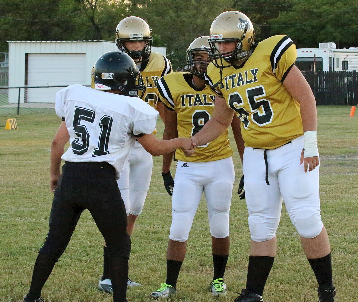 Image: JV captains for Italy were Ty Windham(12), Ray Salas(8) and Austin Pittmon(65) who wish Itasca’s lone captain good luck.