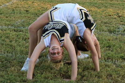 Image: Cheerleaders Karson Holley and Karely Nelson form a spirit spider. (Barry Byers)