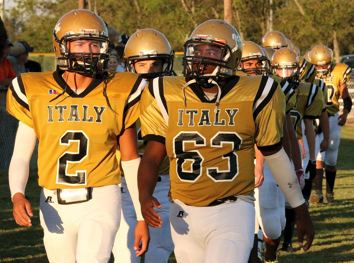 Image: Joe Celis(2) and Kenneth Norwood, Jr.,(63) lead the JV Gladiators into battle.