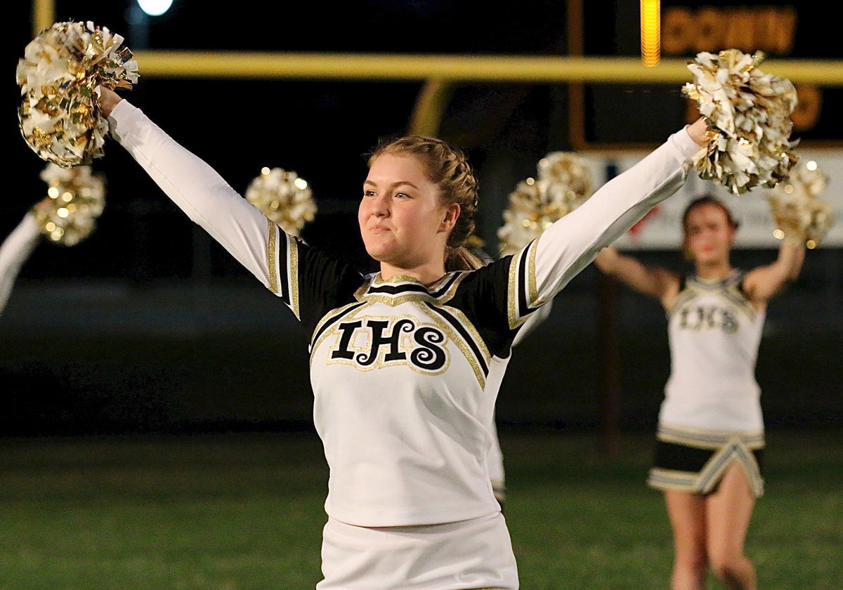 Image: Italy High School cheer captain Taylor Turner helps lead Italy onto the field.