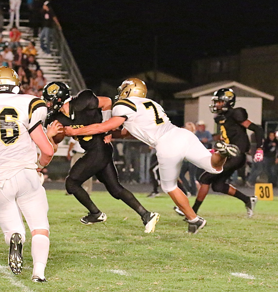 Image: Italy’s Cody Medrano(75) makes a special teams tackle during a kickoff.