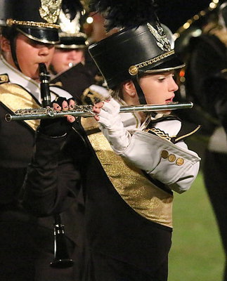 Image: Kristen Viator plays flute during the Gladiator Band’s halftime performance.