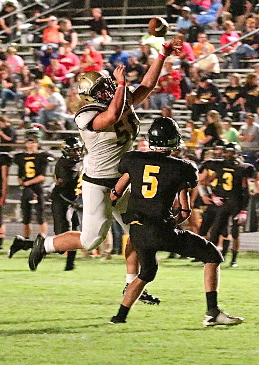 Image: Zain Byers(50) forces an incomplete pass and a Wampus Cat punt.