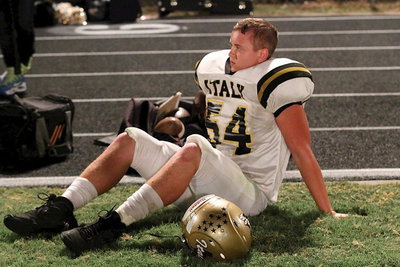 Image: Bailey Walton(54) takes a breather on the sideline.