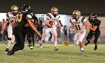 Image: Sophomore sensation Clayton Miller(6) intercepts Itasca’s quarterback and then tries to score his jersey number with help from Coby Bland(40) and Tyler Anderson(11).
